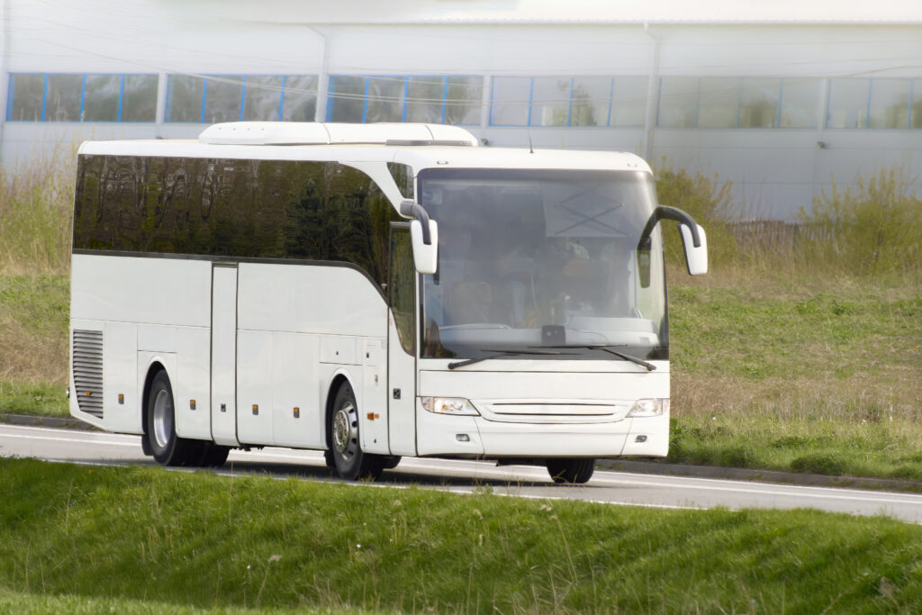 Large size 43-seat coach bus used for group delegate transport in Bali