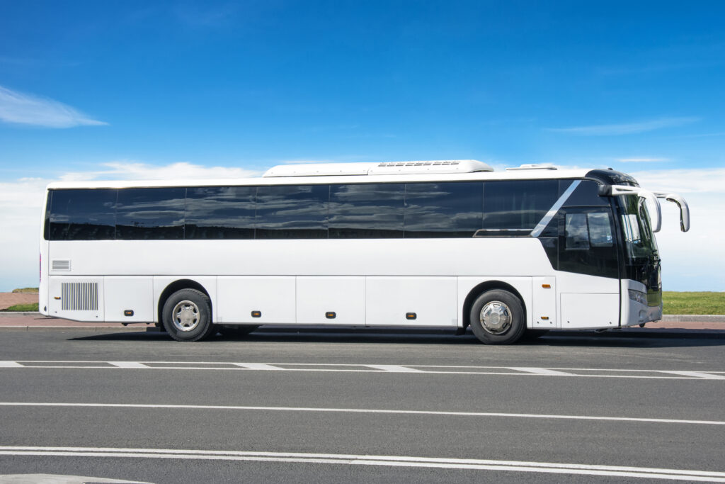 Medium size 25-seat tour bus used for delegate transport in Bali